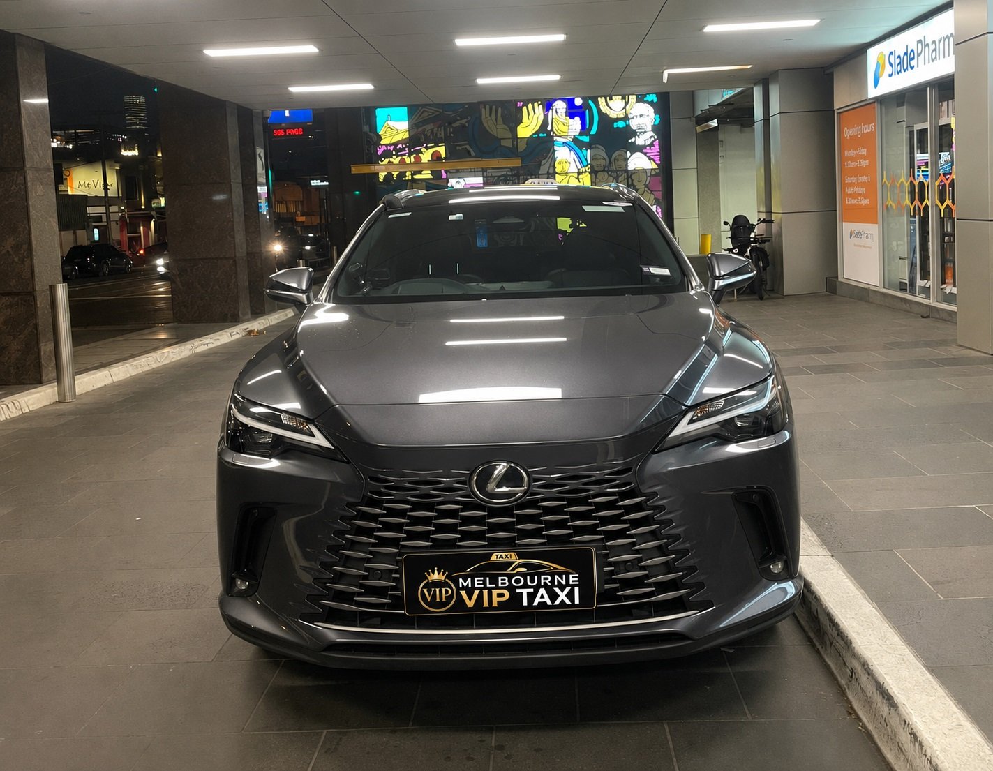 Melbourne VIP Taxi premium black sedan against the Melbourne skyline