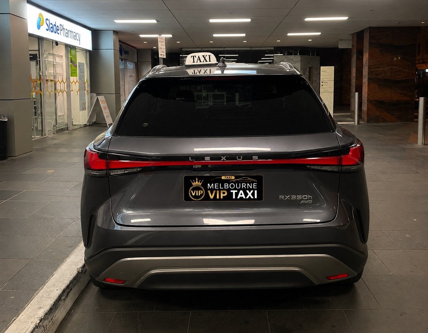 Melbourne VIP Taxi black sedan on Melbourne skyline at night